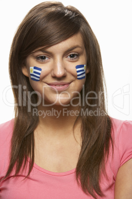 Young Female Sports Fan With Uruguayan Flag Painted On Face