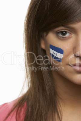 Young Female Sports Fan With Honduran Flag Painted On Face