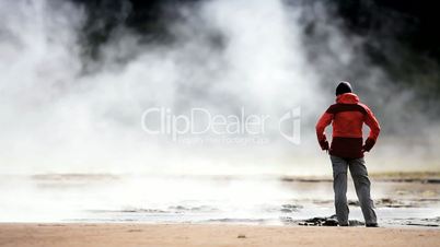 Female Watching Steam from Hot Volcanic Springs