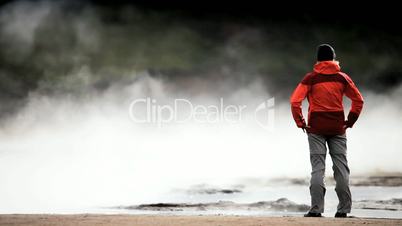 Female Watching Steam from Volcanic Springs