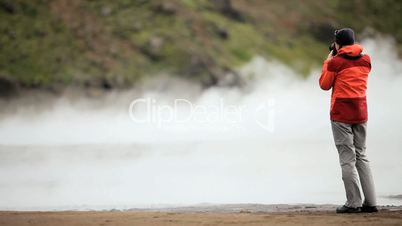 Female Hiker Filming Hot Volcanic Steam