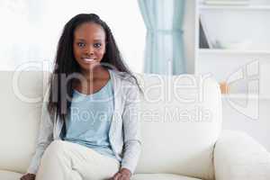 Woman sitting on sofa