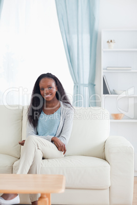Woman sitting in livingroom