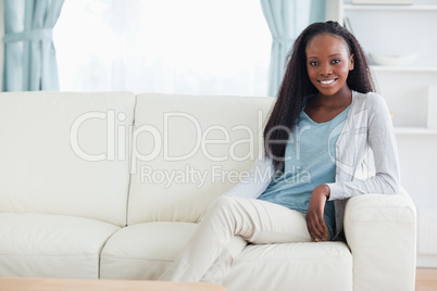 Woman leaning against armrest