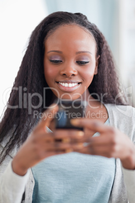 Close up of happy woman reading text message