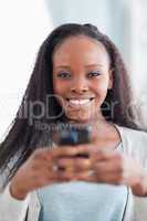 Close up of woman holding smartphone