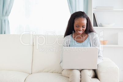 Woman in living room with notebook