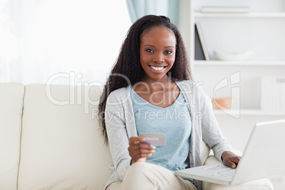 Woman shopping online in living room