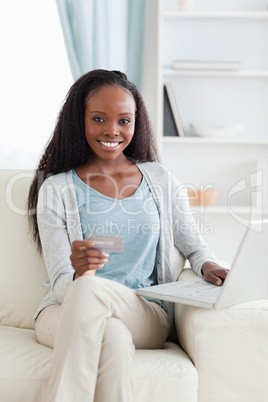 Woman shopping online on sofa