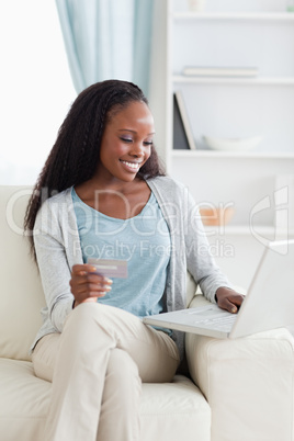 Woman shopping online on couch