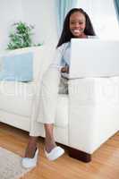 Woman in the living room using her laptop