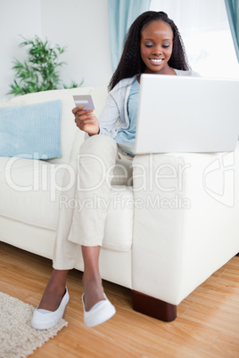 Woman shopping online with credit card