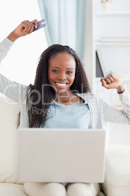 Close up of smiling woman shopping online