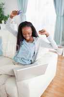 Young woman happy about online shopping