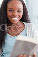 Close up of smiling woman reading