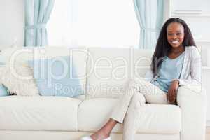Woman leaning back on sofa