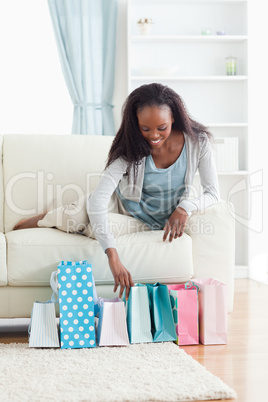 Woman on sofa with shopping