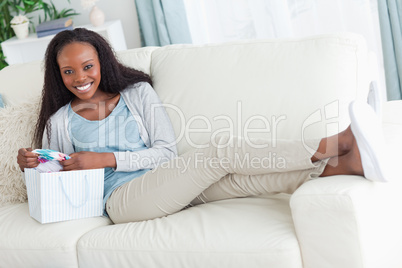 Woman taking a rest on the sofa after shopping