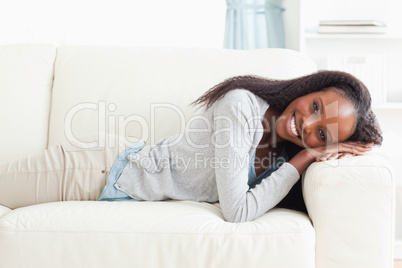 Young woman lying on the sofa Young woman lying on the sofa