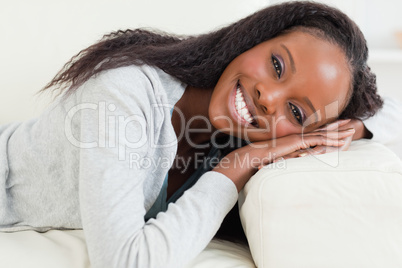 Close up of woman resting on sofa