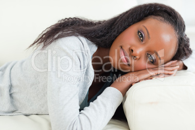 Close up of woman resting on couch