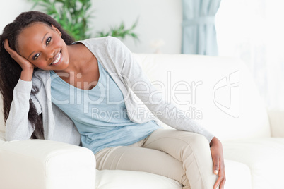 Woman leaning on armrest