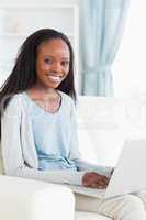 Woman on couch with laptop