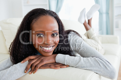 Woman releasing tension on sofa