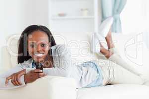 Woman texting on sofa