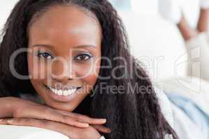 Close up of smiling woman on the sofa