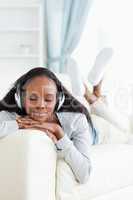Woman with eyes closed enjoying music