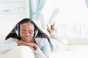 Woman with closed eyes enjoying music
