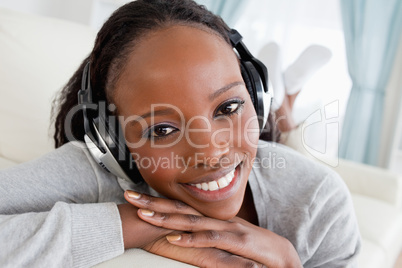 Close up of woman relaxing with music on her couch