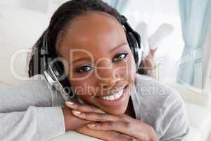Close up of woman relaxing with music on her couch