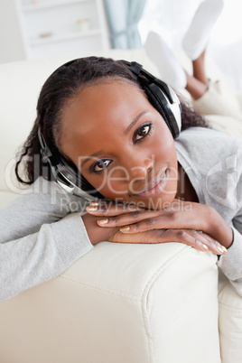 Close up of woman on sofa enjoying music