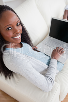 Woman on sofa with her laptop