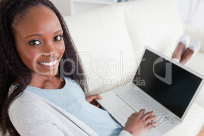 Woman on couch with her laptop