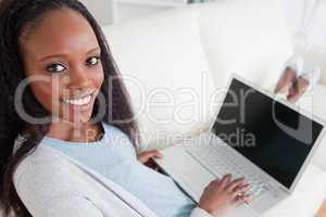 Woman on couch with her laptop