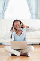 Close up of woman sitting on the floor enjoying music