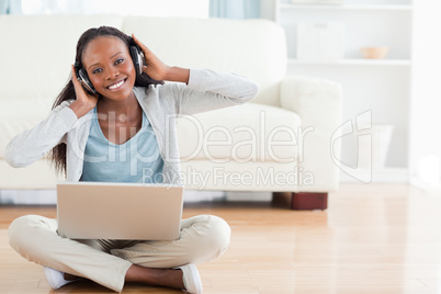 Woman on the floor enjoying music