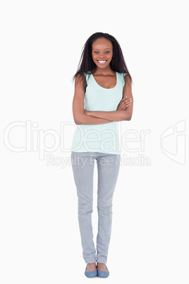 Woman with arms folded on white background