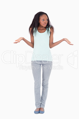 Woman having no idea against a white background