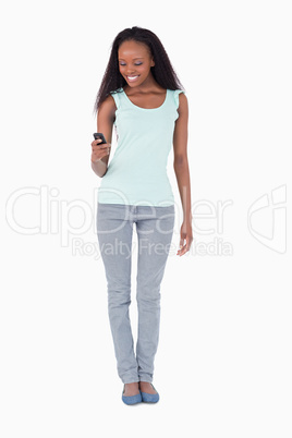 Woman texting on white background