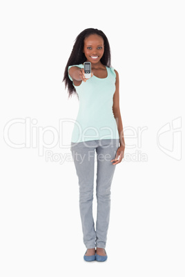 Woman showing her cellphone on white background