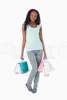 Woman with her shopping on white background