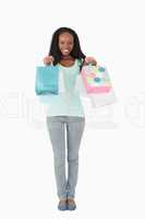 Woman presenting her shopping on white background