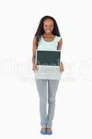 Woman presenting her laptop on white background
