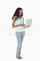 Woman using her laptop on white background
