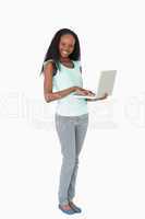 Woman typing on her laptop on white background
