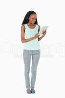 Woman using tablet on white background